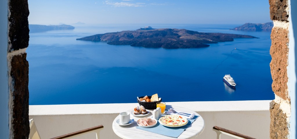 Private terrace breakfast with panoramic Santorini caldera views 