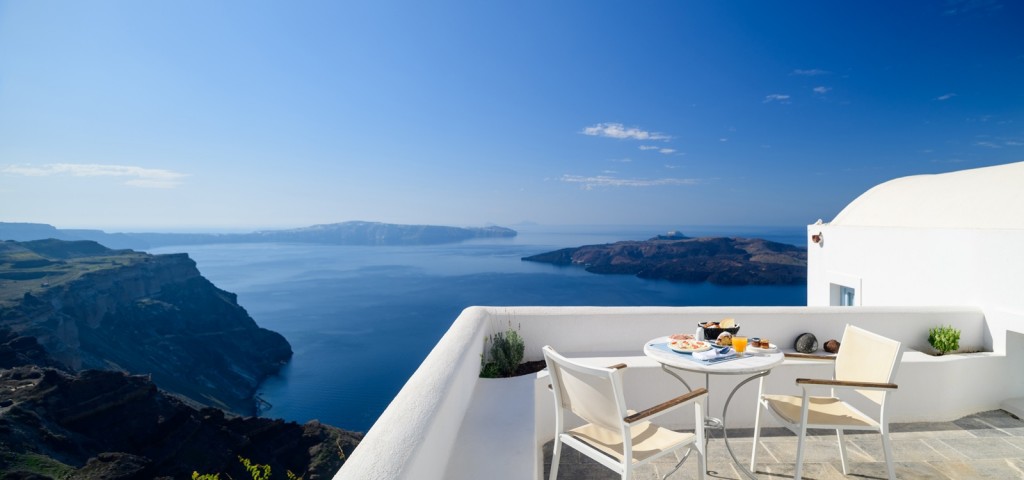 Private terrace breakfast overlooking the Santorini caldera