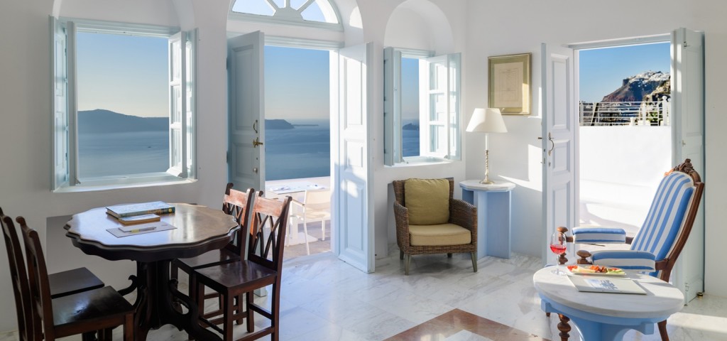 Caldera-view sitting area inside the Mansion Sunset View residence 